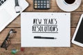 Text new years`s resolutions on note, Office desk with computer Royalty Free Stock Photo